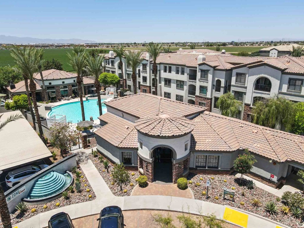 an aerial view of a resort style community with a swimming pool