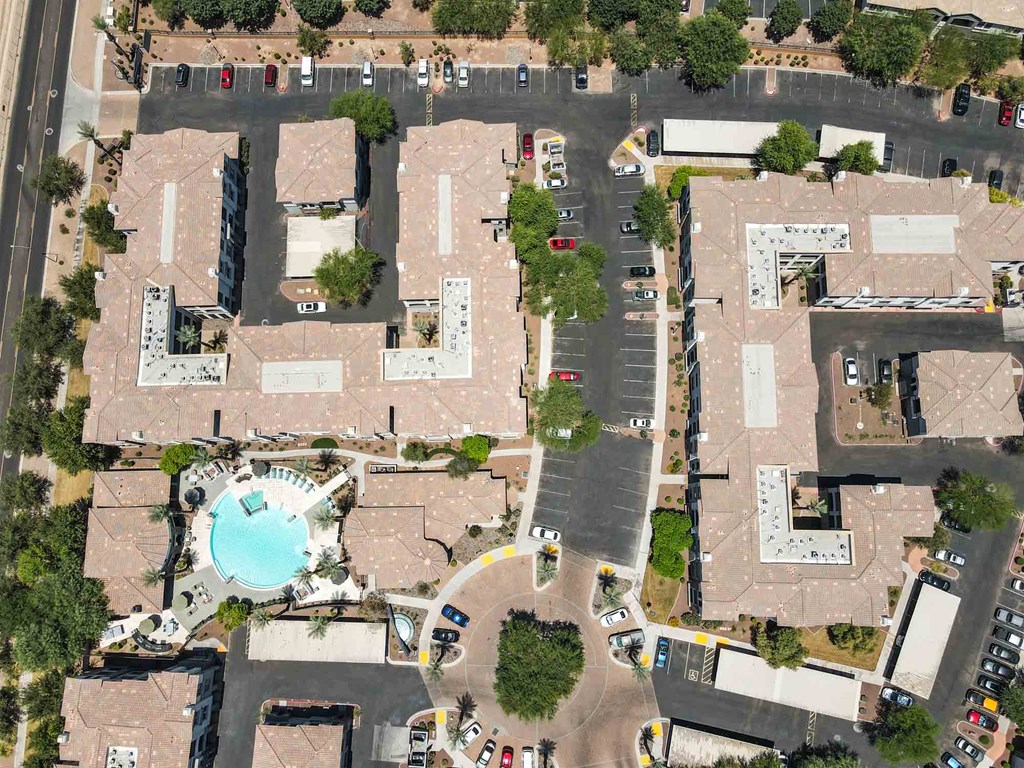 arial view of an apartment complex with a swimming pool