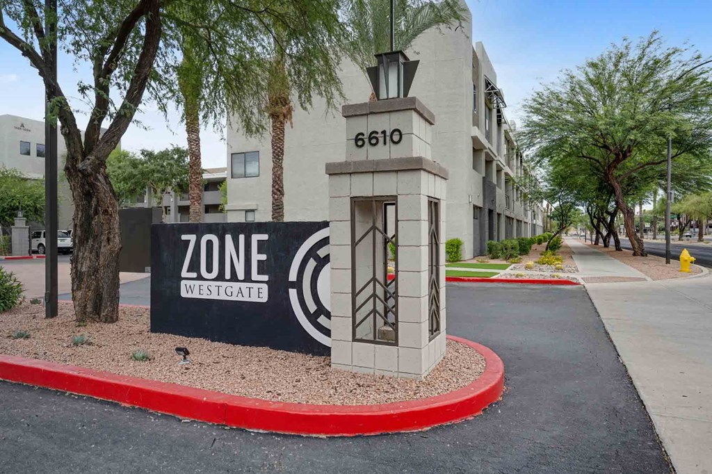 a sign that says zone westgate in front of a building