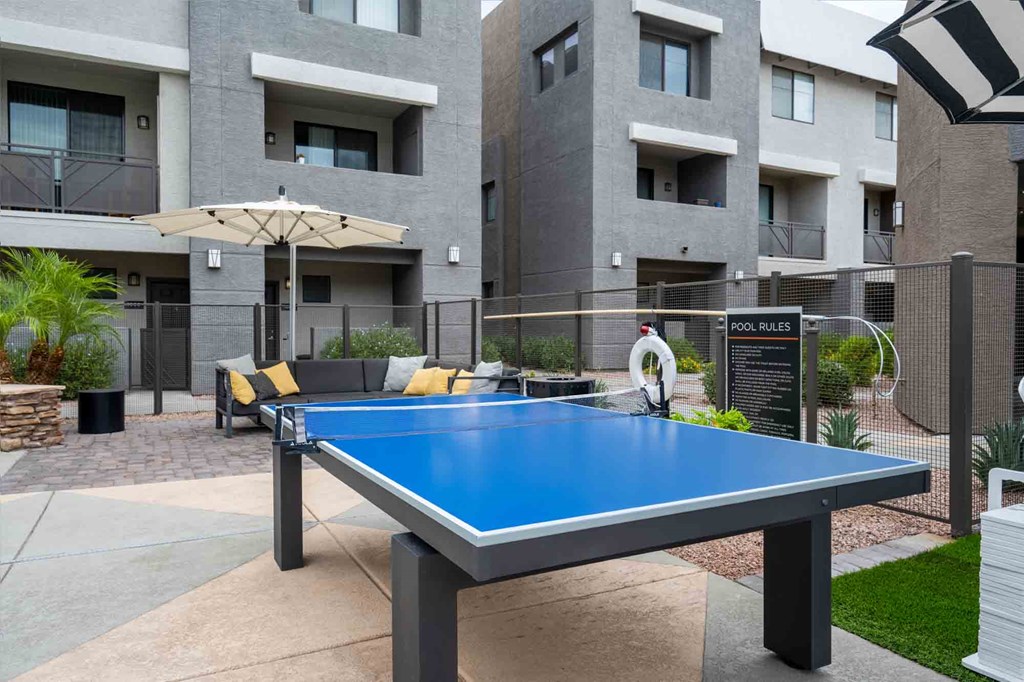 play a game of ping pong at our apartments in tempe