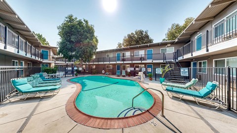 A sunny day at the pool of a residential complex.