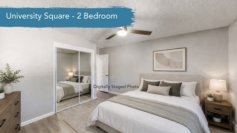 A well-lit, spacious bedroom with a double bed and a mirrored closet door.