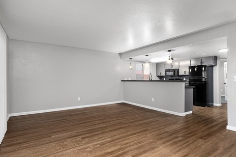 A kitchen area with a bar counter and stove.