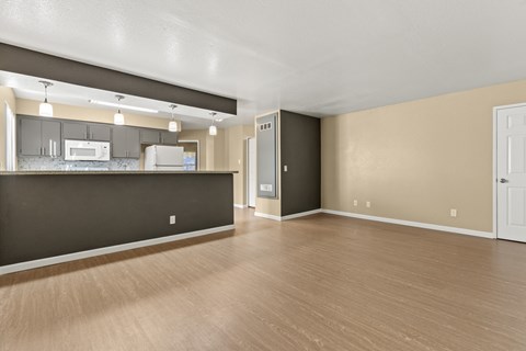 A kitchen area with a countertop and cabinets.