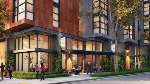 A modern building with people walking in front.
