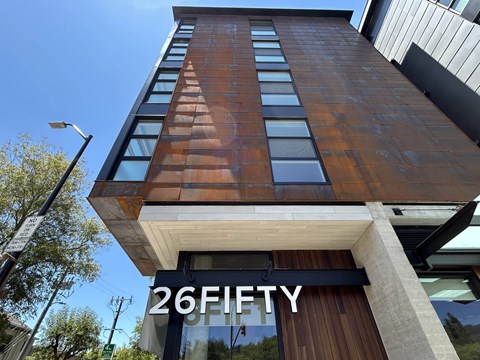 A tall building with the number 26 on it.