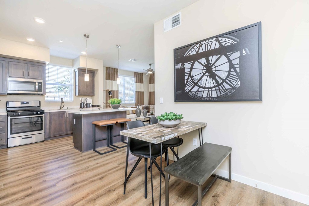 an open kitchen and dining room with a table and chairs