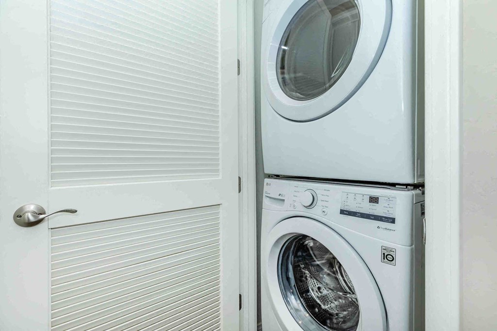 a small laundry room with a washer and dryer