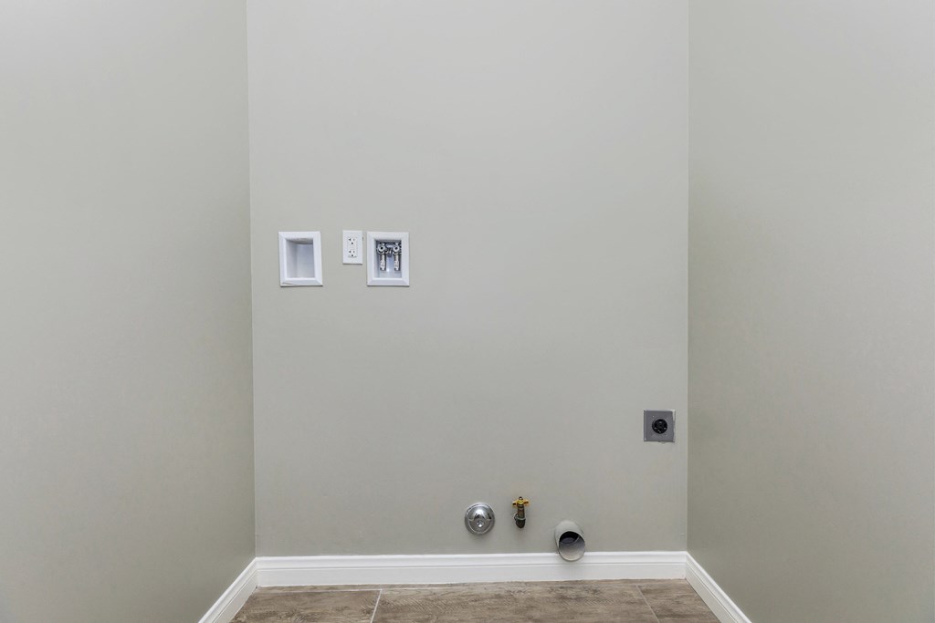 a room with three pictures on the wall and a fire hydrant