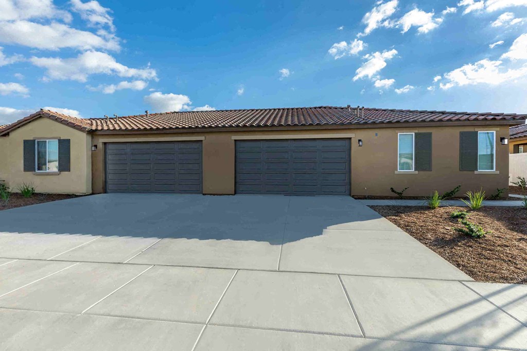 a house with a garage and a concrete driveway
