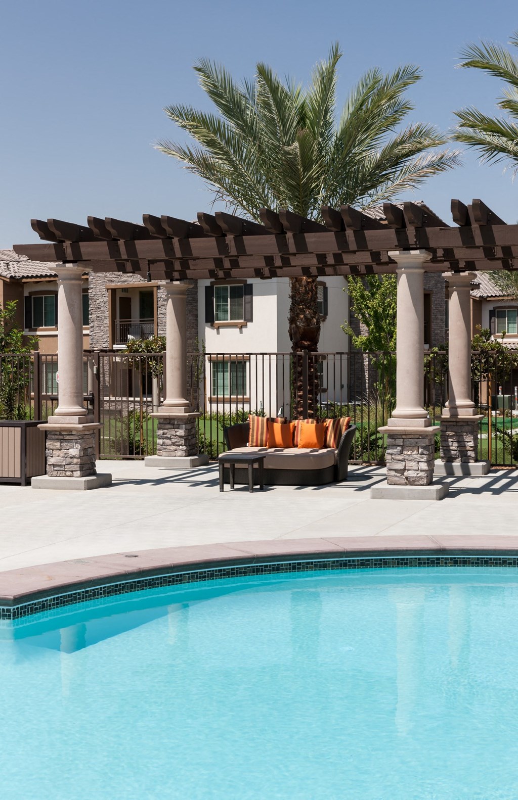 a swimming pool in front of a building