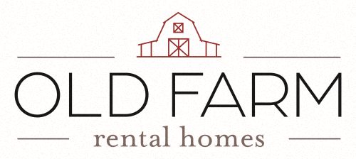 an old farm rental homes logo with a barn and the word old farm on it
