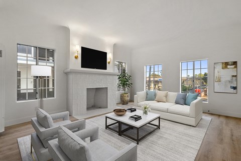 a living room with a couch and a coffee table and a fireplace