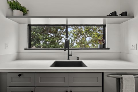 a kitchen with a sink and a window