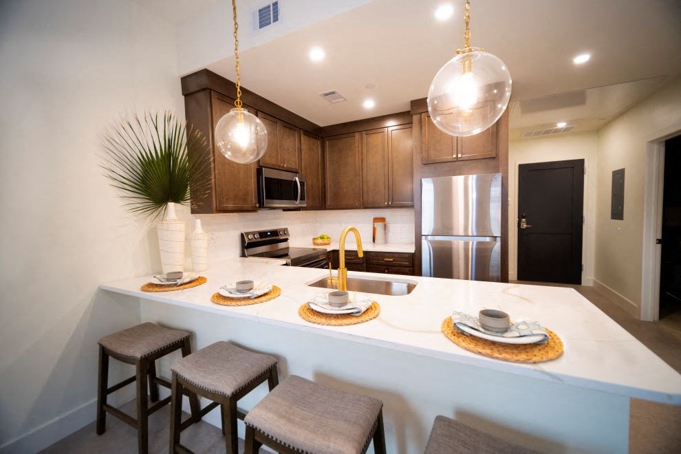 a kitchen with a counter top and a sink