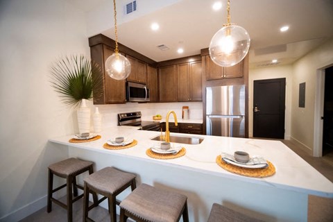 a kitchen with a counter top and a sink