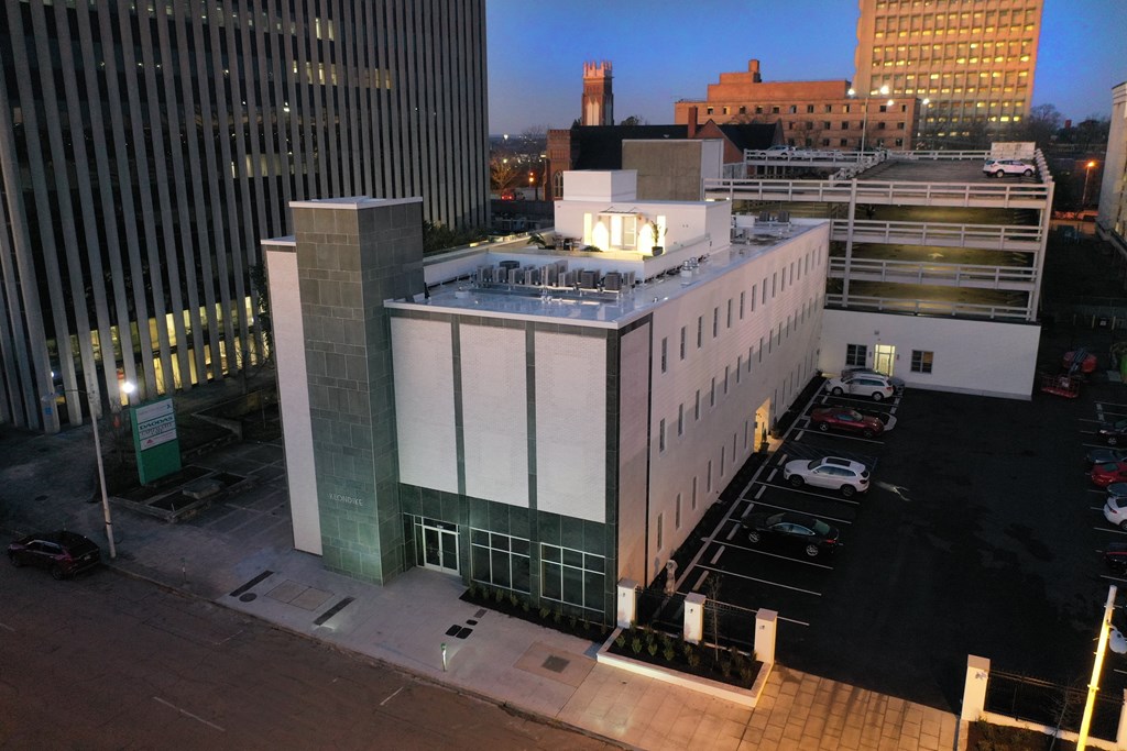 an aerial view of a building in a city at night