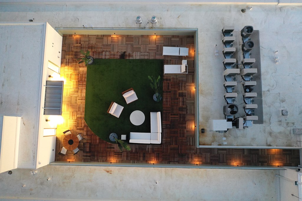 a birds eye view of the living room of a house with a lawn