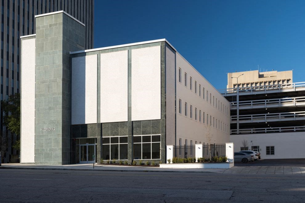 the exterior of a building with a parking lot