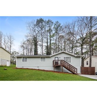 this is a view of the front of the house with the deck