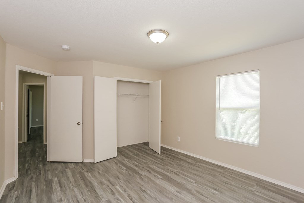 A room with a grey floor and white walls.