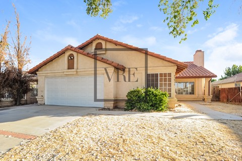 A house with a VRE sign on the front.