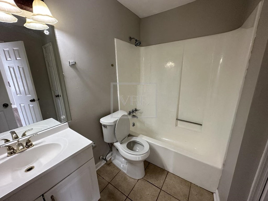 a bathroom with a toilet and a sink