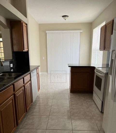 a kitchen with a stove and a sink