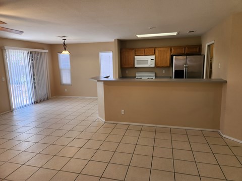 A kitchen area with a counter and appliances.