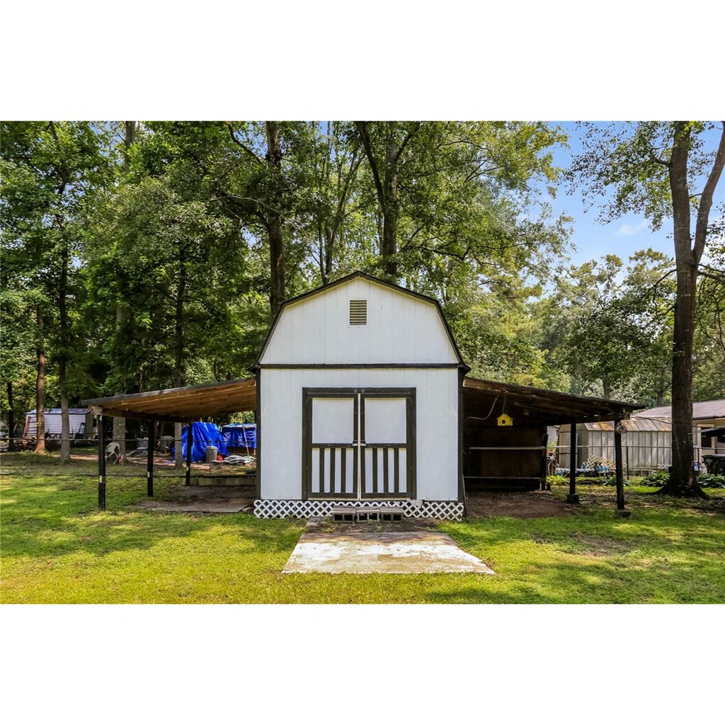 a tiny house in the middle of a field