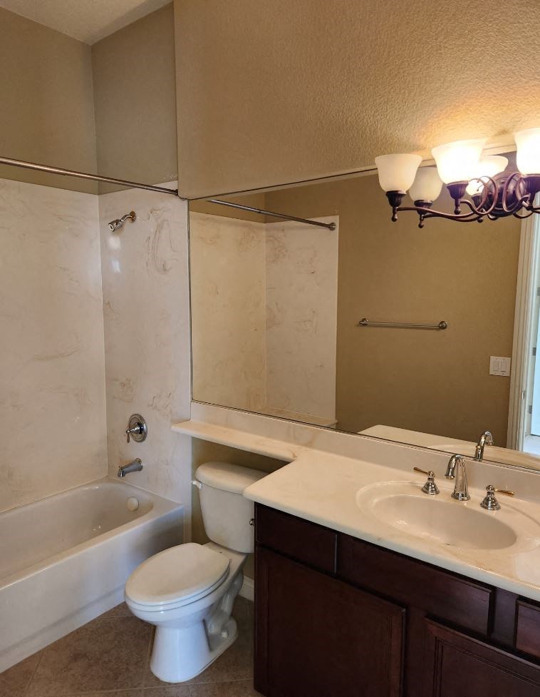 a bathroom with a sink toilet and a bath tub