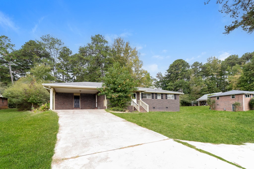 A house with a driveway in front of it.