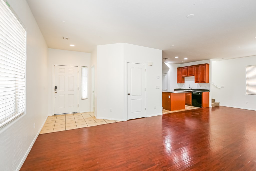A room with wooden floors and white walls.