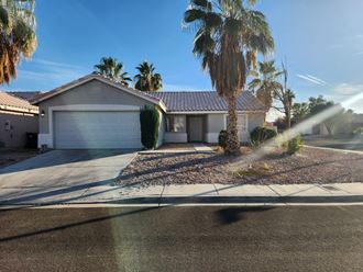 a house with palm trees in front of it