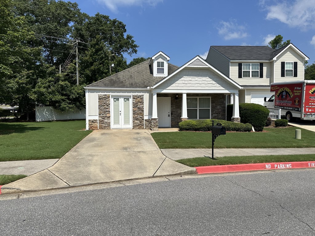 a house with a fire truck parked in front of it