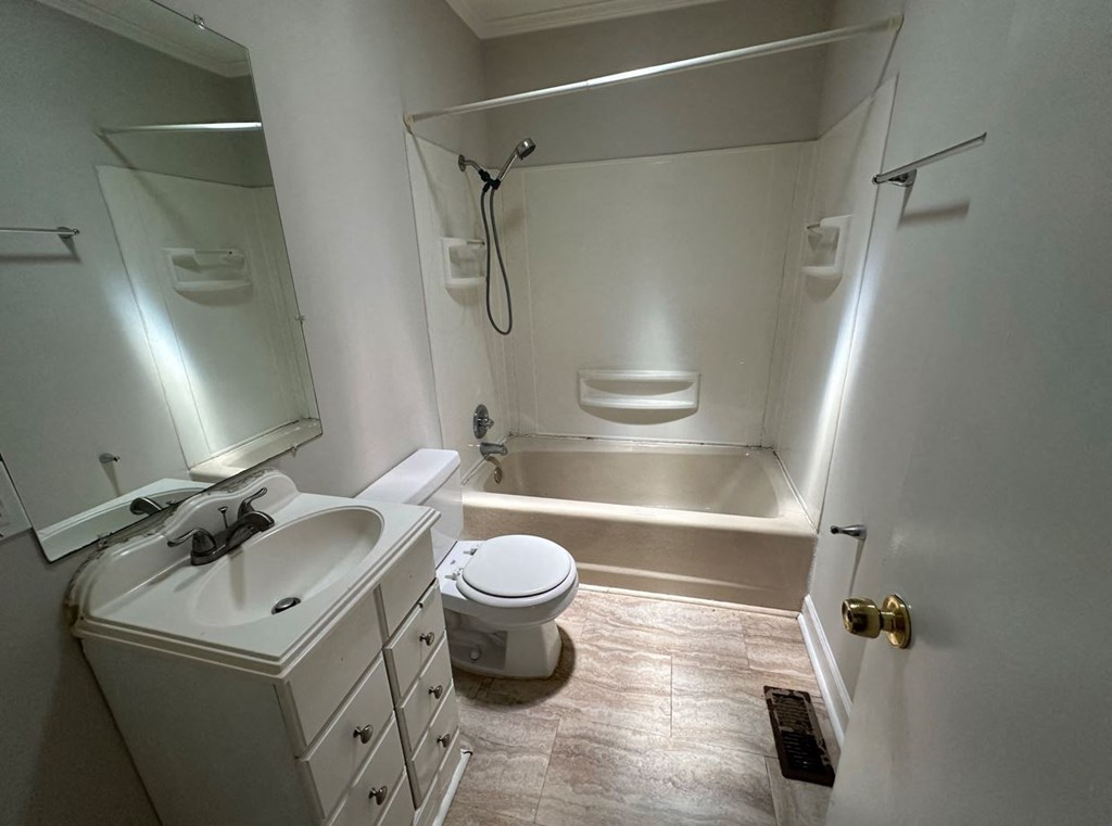 a bathroom with a sink toilet and a bath tub