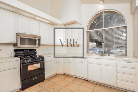 A kitchen with a VRE sign on the wall.