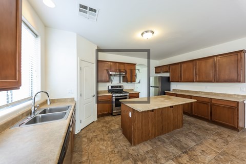 A kitchen with brown cabinets and a countertop.