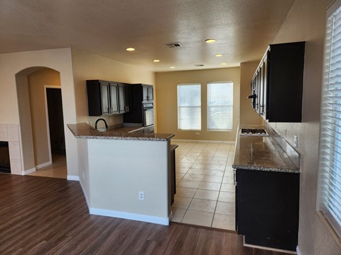 a view of a kitchen with a counter top and a