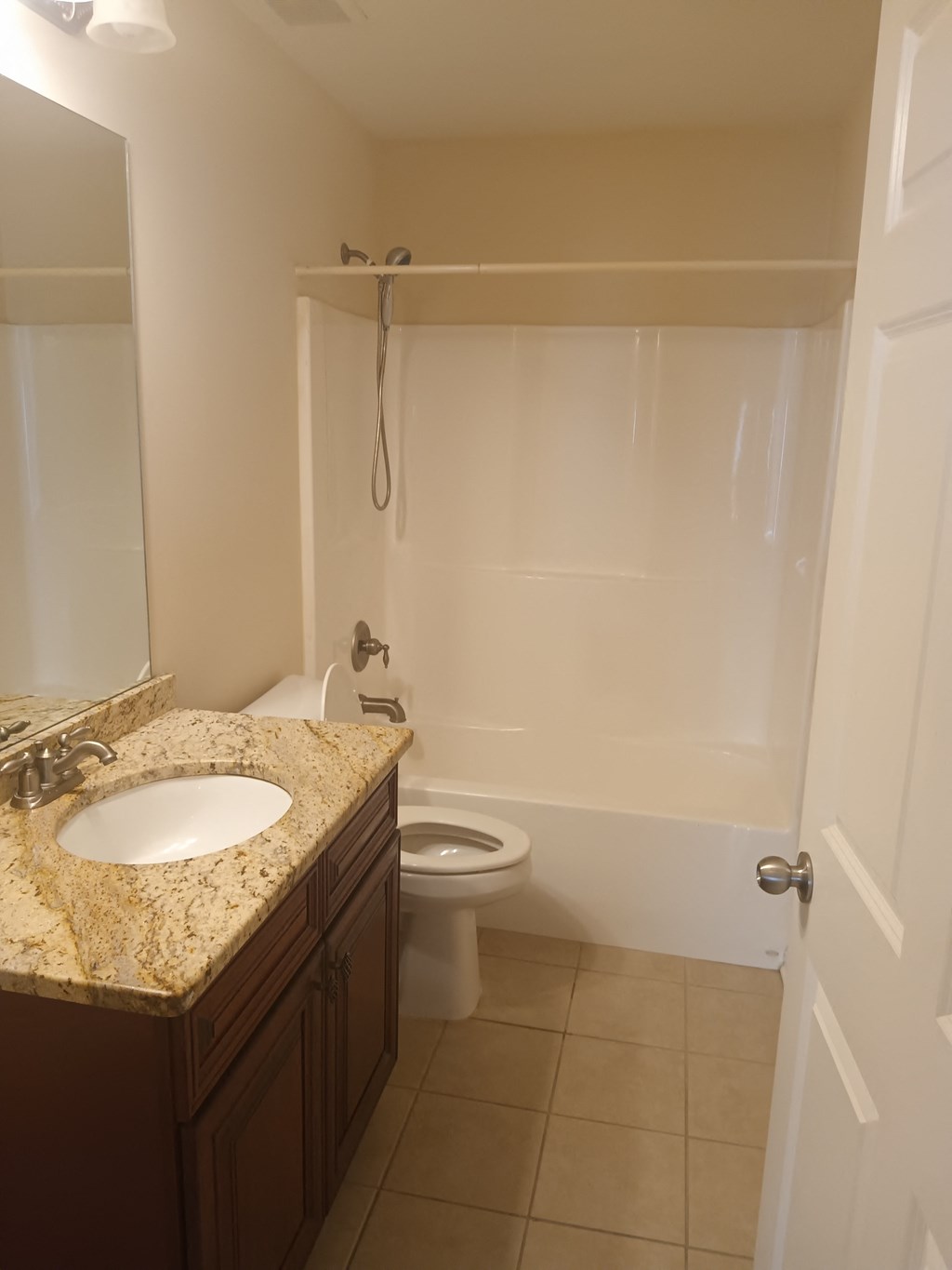 a small bathroom with a sink toilet and shower