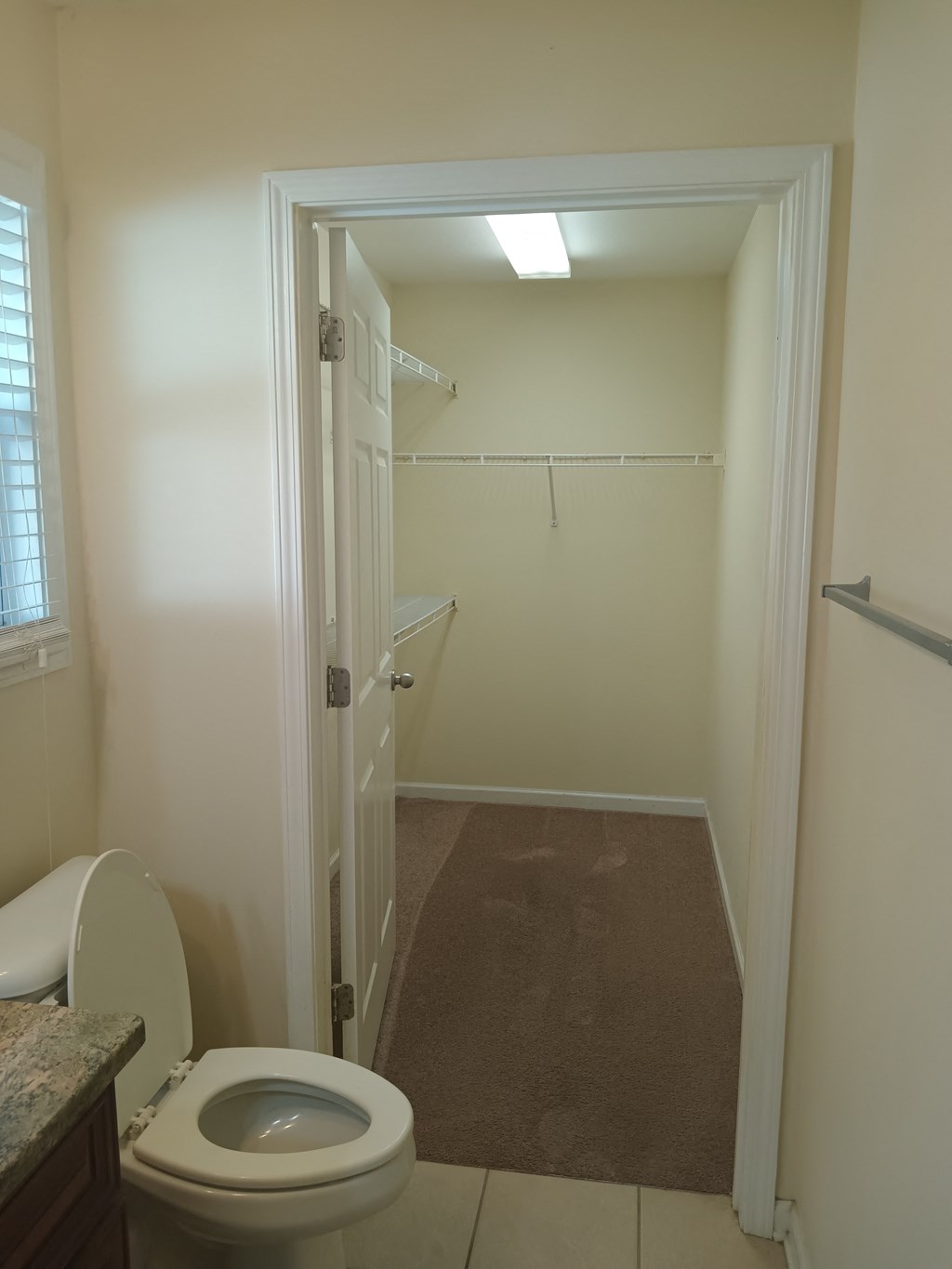 a small bathroom with a toilet and a shower