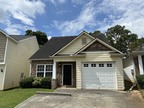 a house with a white garage door in front of it
