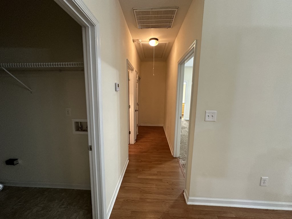 a view of the hallway from the living room looking down the hall to the bedrooms