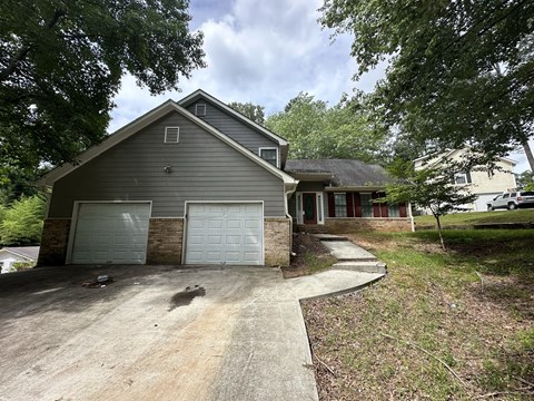 a house with a driveway and a garage door