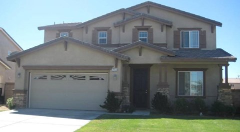 A house with a garage door that is closed.