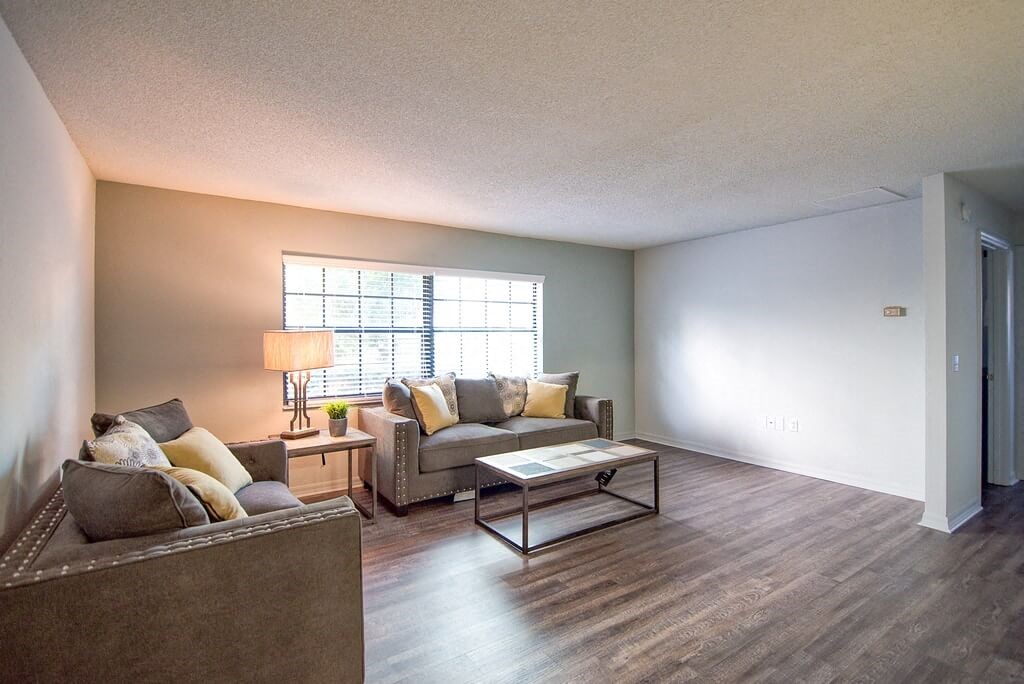 a living room with a couch and a table
