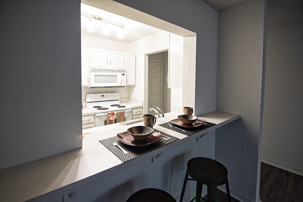 a kitchen with a counter with two bowls on it