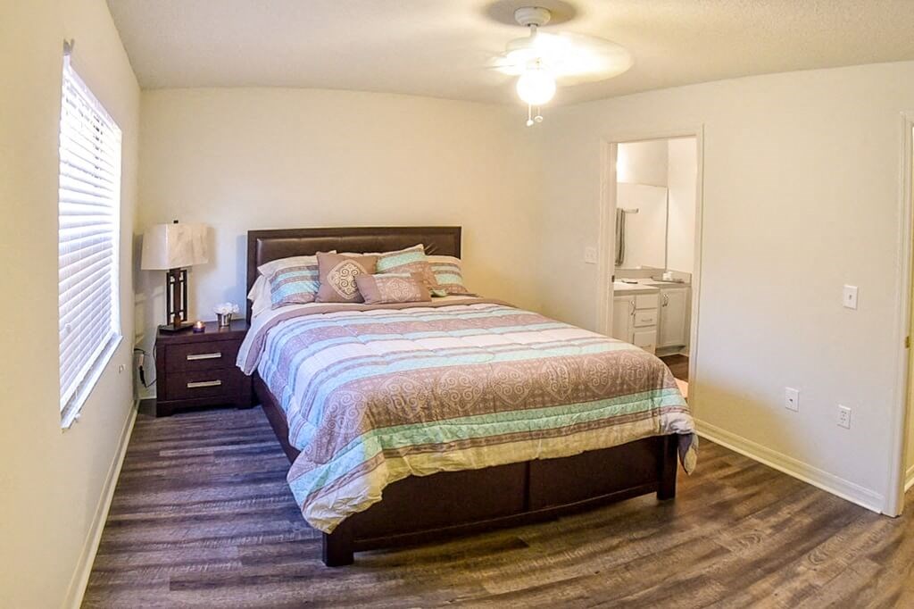 a bedroom with a bed and a closet