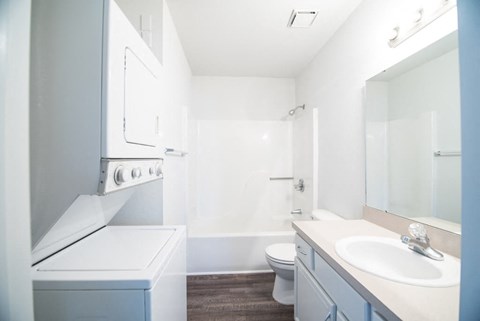 a bathroom with a sink toilet and a mirror