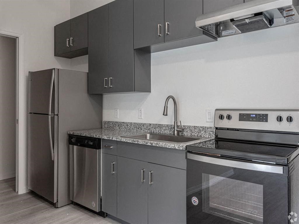 a kitchen with stainless steel appliances and a sink